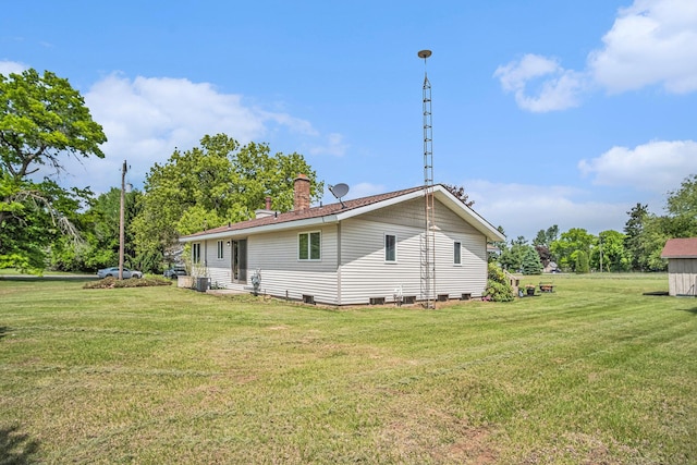 11630 Myers Lake Ave NE, Cedar Springs, MI 49319 - back of house with a lawn and a chimney