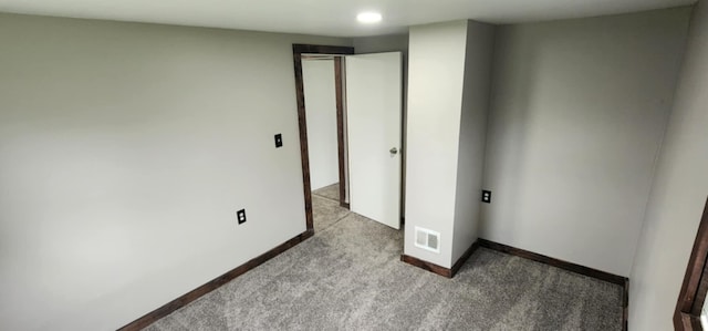 unfurnished bedroom featuring carpet floors, baseboards, and recessed lighting