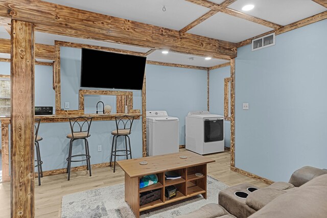23748 Cutler Rd, Newaygo, MI 49337 - living area with washer and clothes dryer, wood finished floors, baseboards, beamed ceiling, and recessed lighting