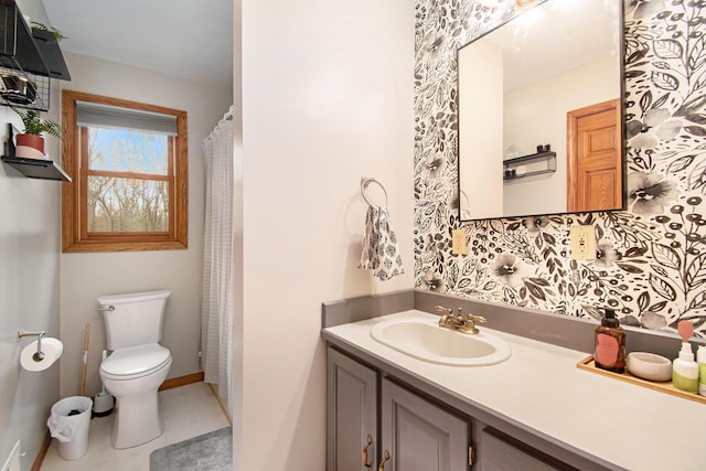 23127 Kendaville Rd, Pierson, MI 49339 - full bathroom with toilet, vanity, and baseboards