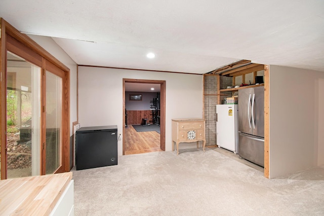 23127 Kendaville Rd, Pierson, MI 49339 - kitchen featuring freestanding refrigerator, refrigerator, carpet flooring, and recessed lighting