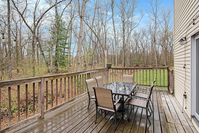 23127 Kendaville Rd, Pierson, MI 49339 - wooden deck featuring outdoor dining space
