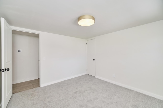 923 Maple St, Ludington, MI 49431 - carpeted spare room with baseboards