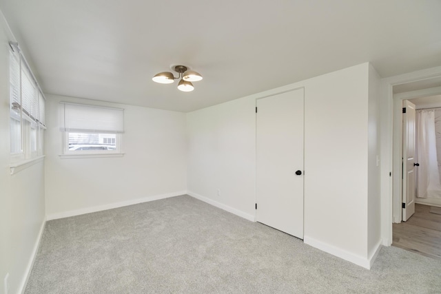 923 Maple St, Ludington, MI 49431 - spare room with light colored carpet and baseboards