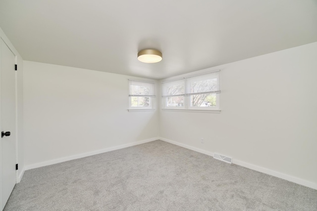 923 Maple St, Ludington, MI 49431 - empty room featuring carpet floors and baseboards