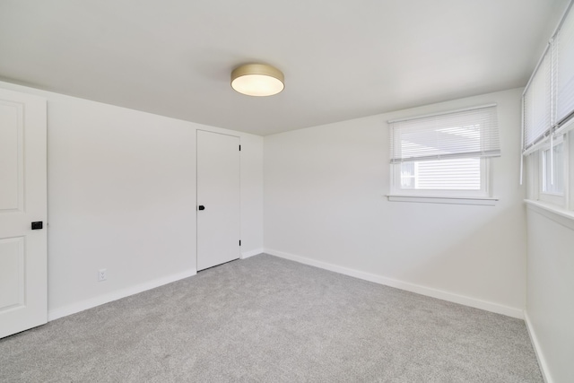 923 Maple St, Ludington, MI 49431 - carpeted spare room featuring baseboards