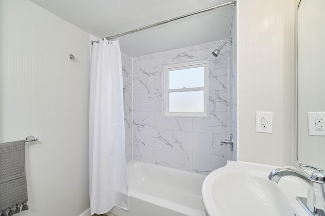 923 Maple St, Ludington, MI 49431 - bathroom with a sink and shower / bath combo with shower curtain