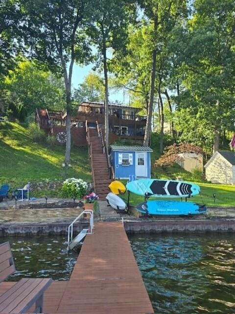 dock area featuring a water view and stairs
