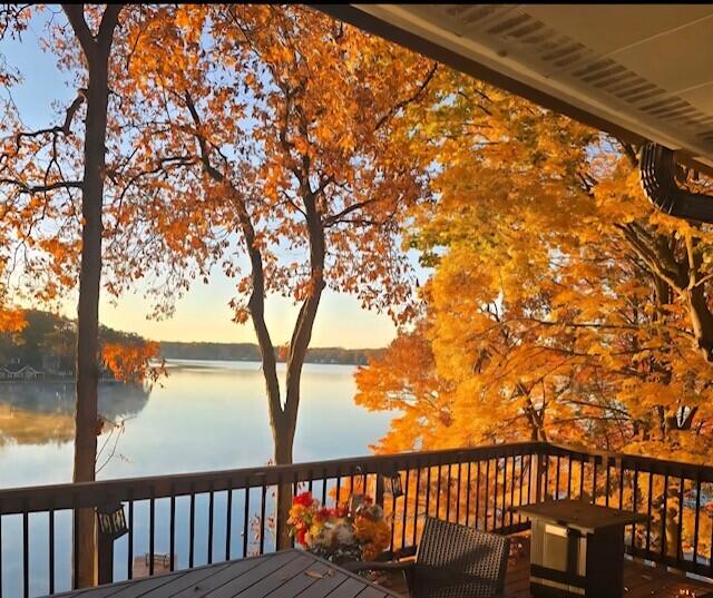 deck featuring a water view