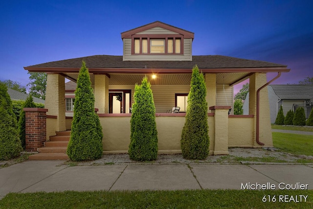 626 Academy St, Portland, MI 48875 - view of front facade with a porch, a shingled roof, and a fenced front yard