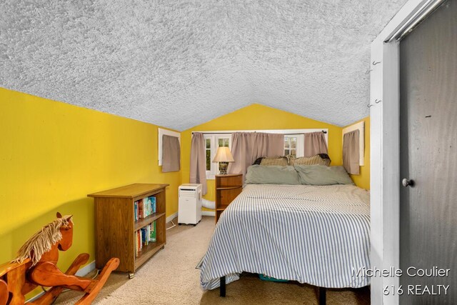 626 Academy St, Portland, MI 48875 - bedroom with carpet floors, lofted ceiling, and a textured ceiling