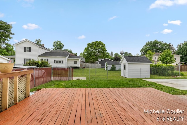 626 Academy St, Portland, MI 48875 - wooden terrace with a fenced backyard and a storage shed