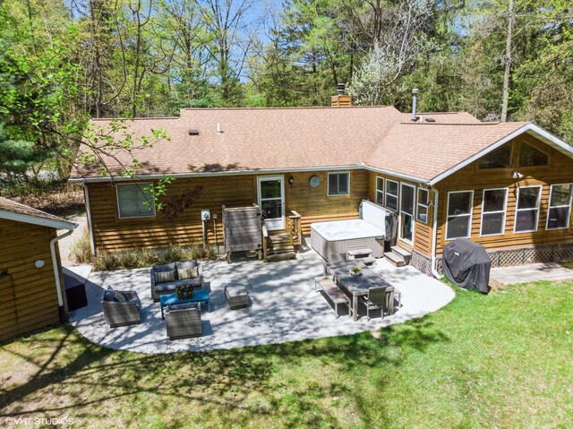 6490 E Chikaming, Sawyer, MI 49125 - rear view of house featuring an outdoor hangout area, entry steps, a chimney, a patio, and a lawn
