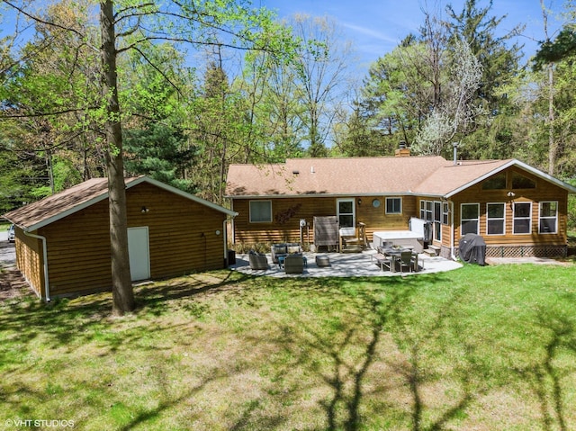 6490 E Chikaming, Sawyer, MI 49125 - rear view of house featuring entry steps, a patio area, a yard, and a chimney