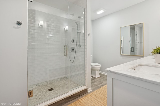 6490 E Chikaming, Sawyer, MI 49125 - full bathroom with wood finished floors, a stall shower, toilet, and vanity