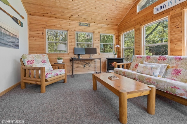 6490 E Chikaming, Sawyer, MI 49125 - carpeted living area with lofted ceiling, plenty of natural light, wood walls, baseboards, and wood ceiling