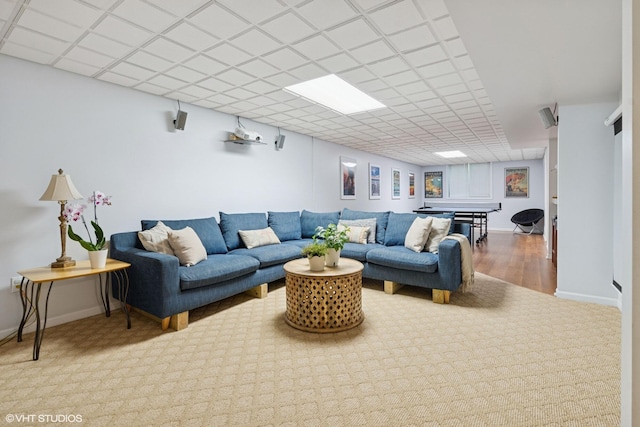 6490 E Chikaming, Sawyer, MI 49125 - living area featuring carpet flooring, a drop ceiling, and baseboards
