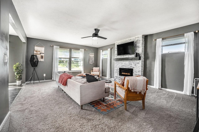 5790 Paxton Ct, Portage, MI 49024 - living room featuring a ceiling fan, carpet, a fireplace, and baseboards
