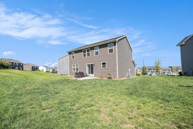 5790 Paxton Ct, Portage, MI 49024 - rear view of property with a lawn, a patio, and central AC