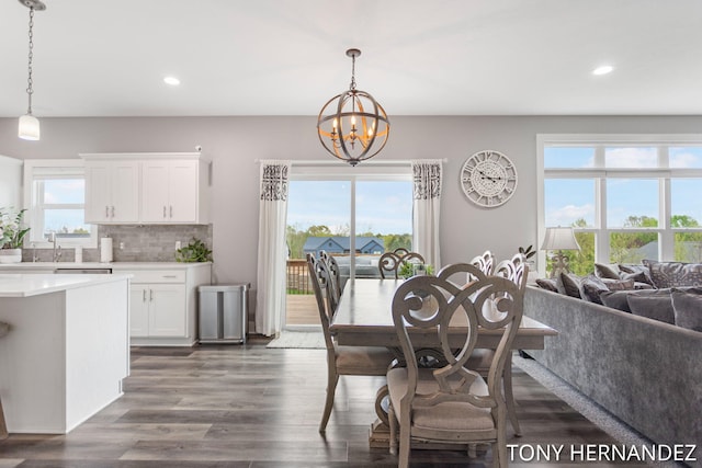 7104 Crimson Ct, Hudsonville, MI 49426 - dining room with a chandelier, recessed lighting, and dark wood-type flooring