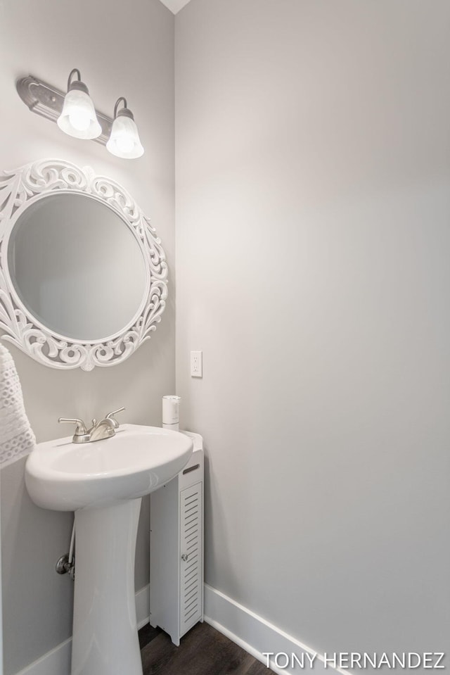 7104 Crimson Ct, Hudsonville, MI 49426 - bathroom featuring baseboards and wood finished floors