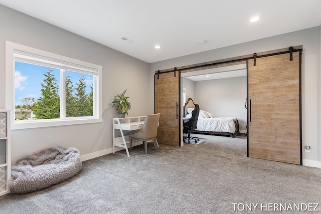 7104 Crimson Ct, Hudsonville, MI 49426 - carpeted bedroom with a barn door, recessed lighting, and baseboards