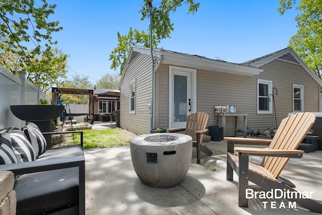 2151 Anderson Dr SE, Grand Rapids, MI 49506 - view of patio / terrace with fence and an outdoor living space with a fire pit