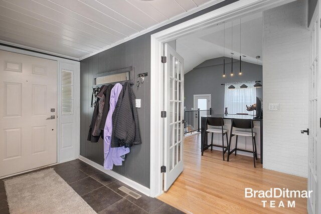 2151 Anderson Dr SE, Grand Rapids, MI 49506 - tiled entrance foyer with lofted ceiling and baseboards