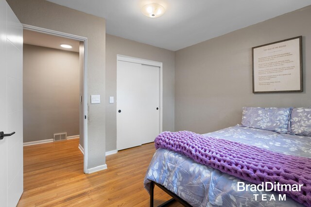 2151 Anderson Dr SE, Grand Rapids, MI 49506 - bedroom featuring light wood-style flooring, baseboards, and a closet