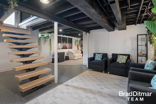 2151 Anderson Dr SE, Grand Rapids, MI 49506 - below grade area featuring stairs and baseboards