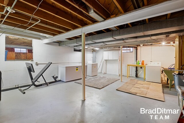 2151 Anderson Dr SE, Grand Rapids, MI 49506 - basement featuring separate washer and dryer, fridge, and a sink