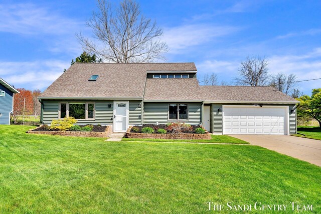 17083 Spahr St, Spring Lake, MI 49456 - view of front facade with a garage, a shingled roof, concrete driveway, and a front yard
