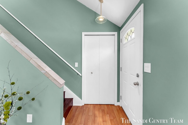 17083 Spahr St, Spring Lake, MI 49456 - entrance foyer with stairs, wood finished floors, and vaulted ceiling