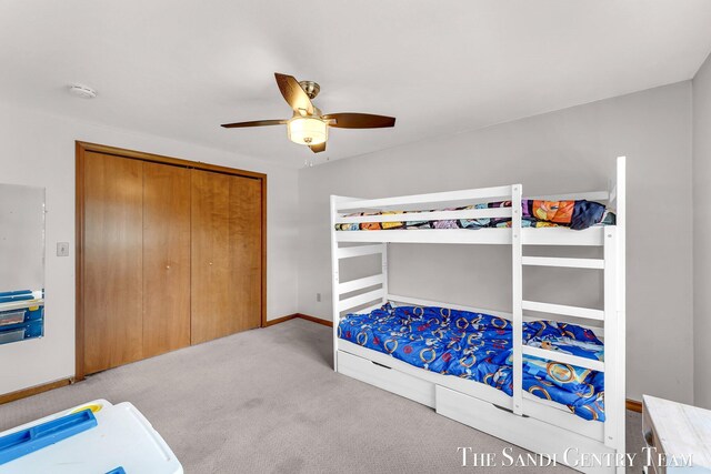 17083 Spahr St, Spring Lake, MI 49456 - bedroom with carpet flooring, a closet, a ceiling fan, and baseboards