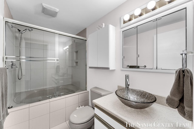 17083 Spahr St, Spring Lake, MI 49456 - full bathroom with tiled shower / bath, toilet, and vanity