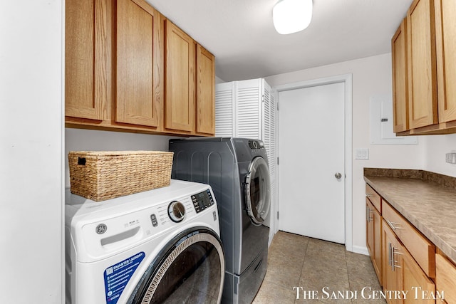 17083 Spahr St, Spring Lake, MI 49456 - laundry room featuring washer and dryer, cabinet space, and light tile patterned flooring
