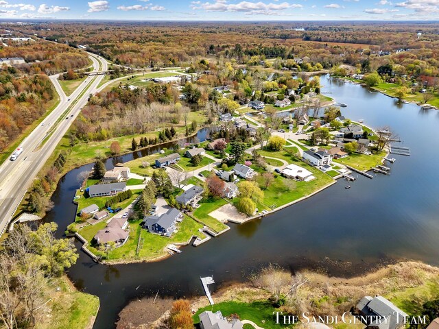 17083 Spahr St, Spring Lake, MI 49456 - aerial view of property and surrounding area featuring a large body of water and nearby suburban area