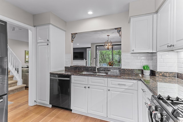 2485 Wildbrook Run Unit 154, Bloomfield Hills, MI 48304 - kitchen featuring dishwasher, a sink, gas range, and white cabinetry