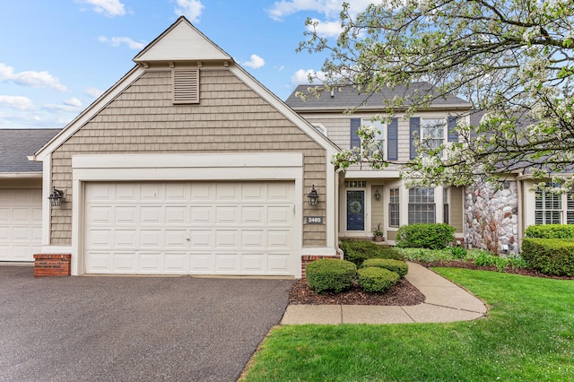 2485 Wildbrook Run Unit 154, Bloomfield Hills, MI 48304 - view of front of home featuring asphalt driveway, an attached garage, and a shingled roof
