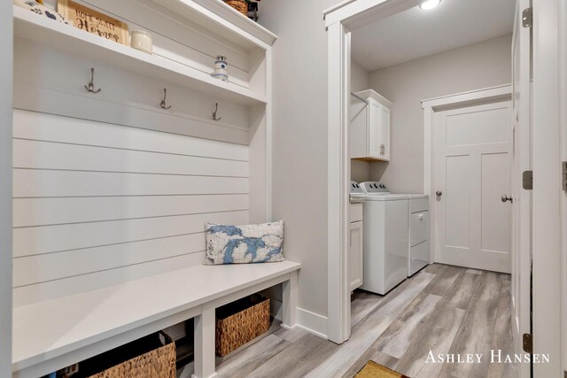 4700 Albright Ct SW Unit 6, Wyoming, MI 49418 - laundry area with cabinet space, washer and dryer, and light wood finished floors
