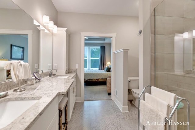 4700 Albright Ct SW Unit 6, Wyoming, MI 49418 - ensuite bathroom with toilet, baseboards, tiled shower, and double vanity