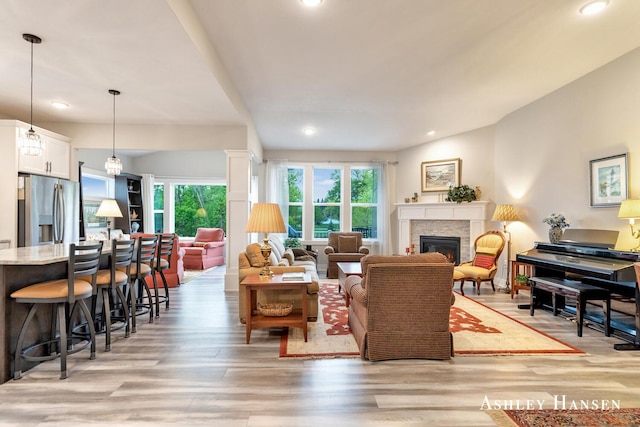 4700 Albright Ct SW Unit 6, Wyoming, MI 49418 - living area with light wood finished floors, a glass covered fireplace, and recessed lighting