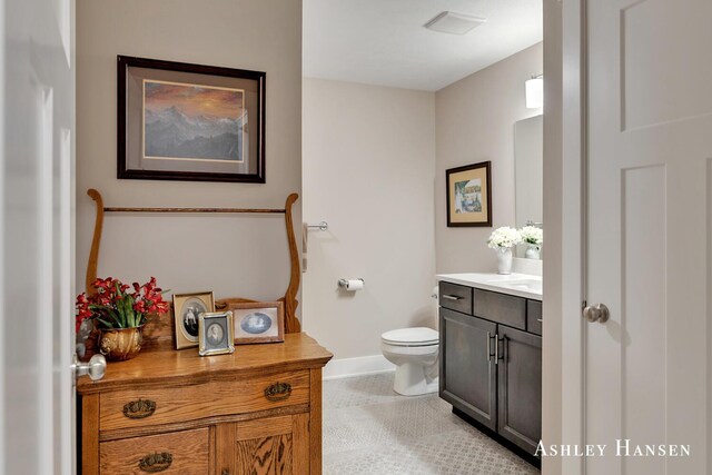 4700 Albright Ct SW Unit 6, Wyoming, MI 49418 - bathroom with vanity, toilet, and baseboards