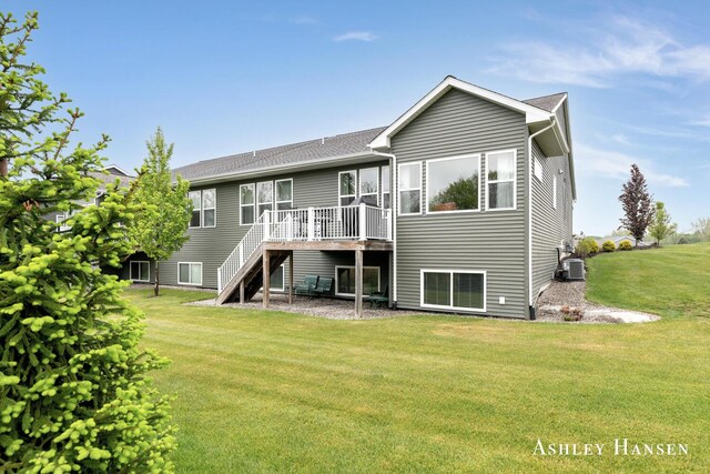 4700 Albright Ct SW Unit 6, Wyoming, MI 49418 - rear view of property with central AC, a wooden deck, a lawn, stairway, and roof with shingles