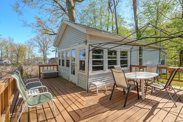 1098210976 Beech Is, Plainwell, MI 49080 - wooden terrace with outdoor dining area