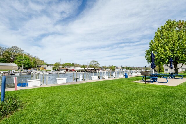 405 Anchors Way, Saint Joseph, MI 49085 - dock area with a yard and a water view