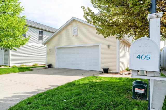 405 Anchors Way, Saint Joseph, MI 49085 - view of front of house featuring an outbuilding, driveway, a front lawn, and an attached garage