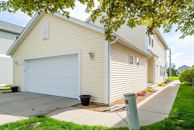 405 Anchors Way, Saint Joseph, MI 49085 - view of home's exterior featuring an attached garage and concrete driveway