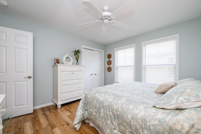 405 Anchors Way, Saint Joseph, MI 49085 - bedroom with light wood-type flooring, baseboards, a closet, and a ceiling fan