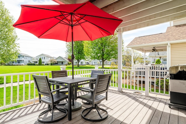 405 Anchors Way, Saint Joseph, MI 49085 - wooden terrace with outdoor dining area, a yard, a residential view, and ceiling fan